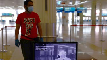 A man is seen through a thermal camera at Dubai International Airport amid the outbreak of the coronavirus disease (COVID-19) in Dubai, UAE April 27, 2020. Picture taken April 27, 2020. REUTERS/Ahmed Jadallah