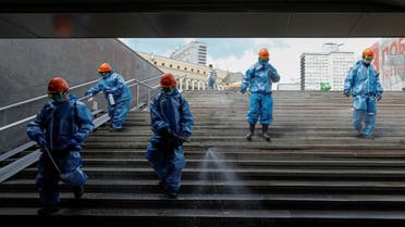 Workers sanitize an underground passage in Moscow, Russia. (File photo: Reuters)
