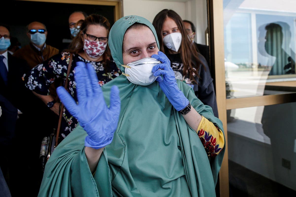 Freed Italian aid worker Silvia Romano arrives at Ciampino military airport in Rome. (Reuters)