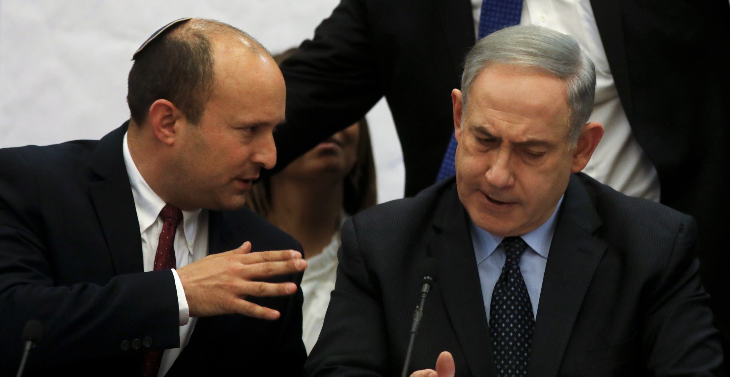 A file photo shows then Prime Minister Benjamin Netanyahu (R) and Defense Minister Naftali Bennett, attend a meeting at the Knesset (parliament) in Jerusalem, on March 4, 2020. (AFP)