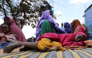 A Somali girl rests at an IDP (internally displaced person) camp near Mogadishu, Somalia on March 12, 2020. (Reuters)
