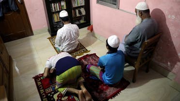 Muslims perform evening prayer in their home during Ramadan as mosques are closed amid concerns over the coronavirus disease (COVID-19) outbreak in Dhaka. (Reuters)