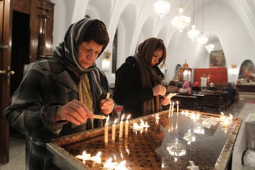 Iranian Christian women light candles at the St. Gregor Armenian Catholic church in Tehran on December 24, 2011. (File photo: AP)