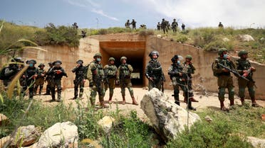 Israeli troops stand guard as Palestinians marking the 72nd anniversary of Nakba and protest against Israeli plan to annex parts of the occupied West Bank, in the village of Sawiya near Nablus May 15, 2020. (Reuters)