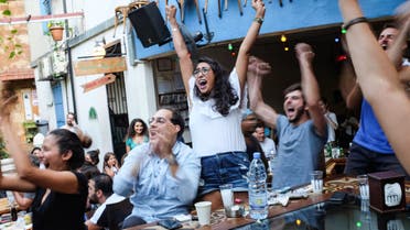 Cafe Em Nazih, a popular restaurant in Beirut, Lebanon, is shown full of patrons during a 2018 World Cup game. Now, compounding economic and coronavirus crises leave the restaurant facing an uncertain future. (Finbar Anderson)