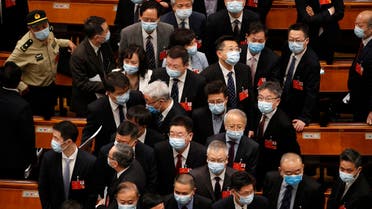 Delegates wearing face masks to protect against the spread of the new coronavirus leave after the opening session of the Chinese People's Political Consultative Conference (CPPCC) at the Great Hall of the People in Beijing on May 21, 2020. (AP)