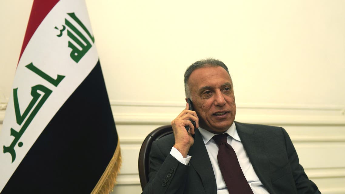 Iraqi Prime Minister Mustafa al-Kadhimi uses his mobile phone at his office in Baghdad, Iraq May 9, 2020. Picture taken May 9, 2020. Iraqi Prime Minister Media Office/Handout via REUTERS ATTENTION EDITORS - THIS IMAGE WAS PROVIDED BY A THIRD PARTY.