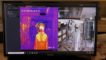 A man is seen through a thermal camera while entering the Cleveland Clinic hospital, amid the coronavirus disease (COVID-19) outbreak, in Abu Dhabi, United Arab Emirates. (Reuters)