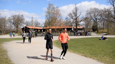 People walk and relax at the recreational area Hellasgarden, amid the outbreak of the coronavirus disease (COVID-19), in the outskirts of Stockholm, Sweden. (Reuters)