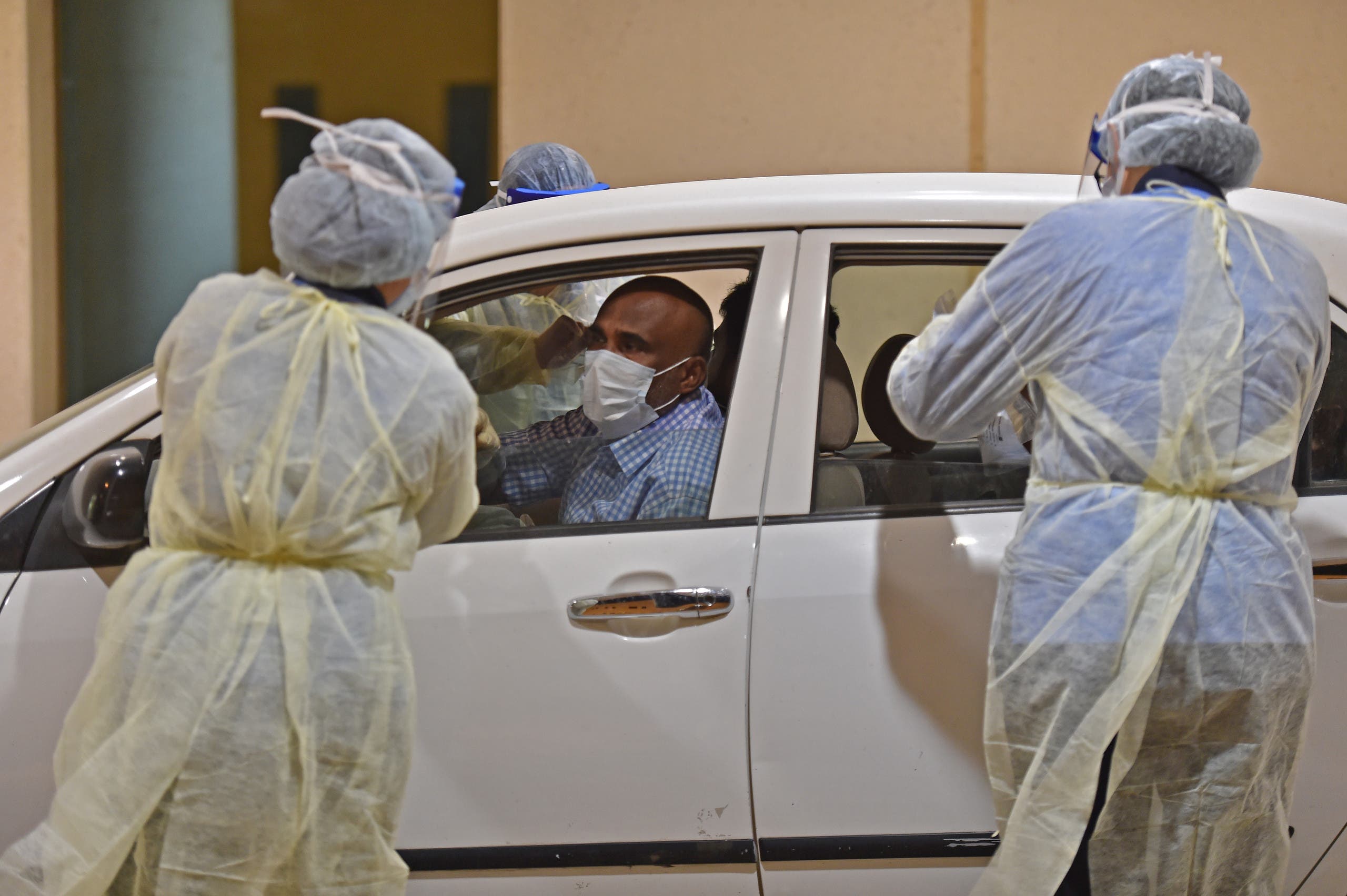 Health workers perform a nose swab test during a drive through coronavirus test campaign held in Diriyah hospital in the Saudi capital Riyadh. (File photo: AFP)
