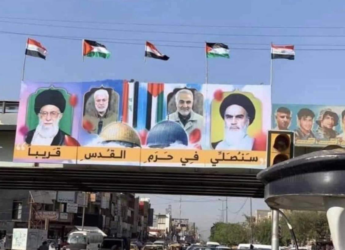 A poster in Baghdad which shows the faces of Khamenei, slain military commander Qassem Soleimani, former supreme leader Ayatollah Ruhollah Khomeini and slain Iraqi militia leader Abu Mahdi al-Mohandes. (Twitter)