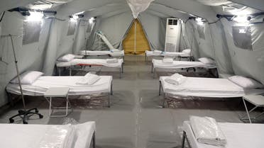 This picture taken on May 13, 2020 shows a view of bunk beds set up at a medical tent in a newly-opened field hospital to treat COVID-19 coronavirus patients in the Muslim holy city of Mecca in Saudi Arabia. 
