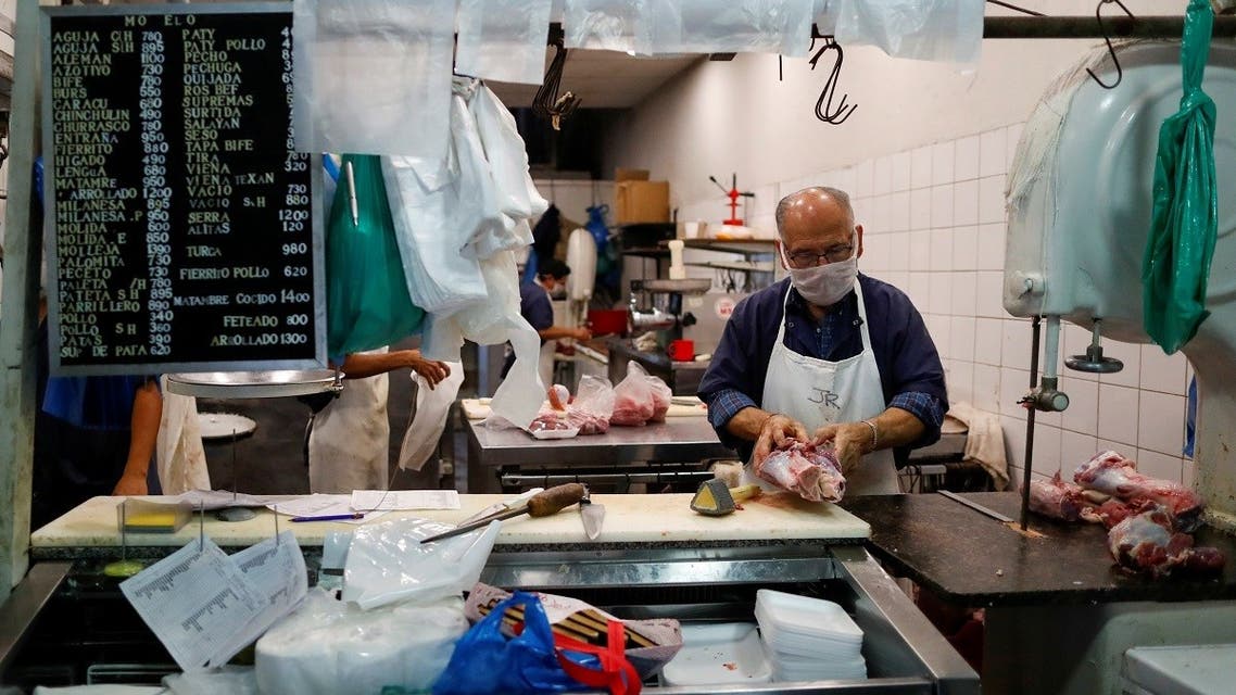  A butcher chops meat at a kosher butcher shop, as Argentina works to organize arrival of a rabbi's delegation from Israel to keep kosher beef lines going in the midst of the coronavirus disease, in Buenos Aires, Argentina May 20, 2020. (Reuters)