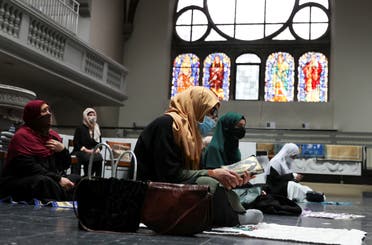 Muslims pray inside the evangelical church of St. Martha's parish, during their Friday prayers, amid the coronavirus outbreak in Berlin, on May 22, 2020. (Reuters) 
