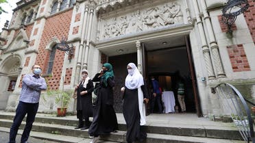 Muslims leave the evangelical church of St. Martha’s parish, after their Friday prayers, in Berlin, Germany, on May 22, 2020.  (Reuters) 