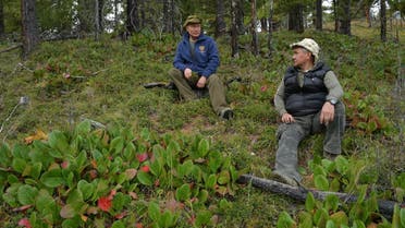In this file photo taken on October 06, 2019 President Putin (L) and Defense Minister Shoigu speak during Putin’s leisure time in the Siberian Taiga area. (AFP)