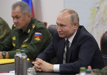 President Putin, accompanied by Defense Minister Shoigu, meets with Syrian President (unseen) at the headquarters of the Russian forces in the Syrian capital Damascus on January 7, 2020. (AFP)