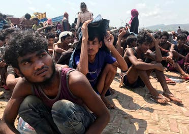Rohingya refugees gather after being rescued in Teknaf near Cox's Bazar, Bangladesh, on Thursday, April 16, 2020. (AP)