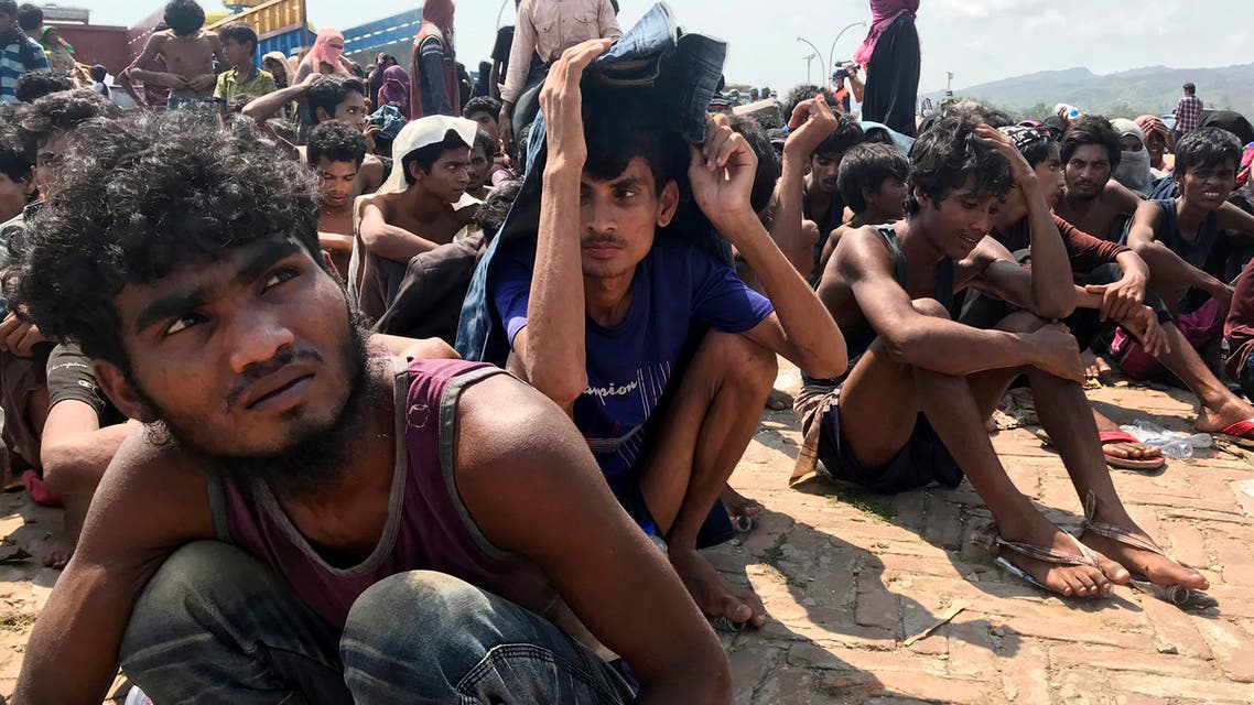 Rohingya refugees gather after being rescued in Teknaf near Cox's Bazar, Bangladesh, on Thursday, April 16, 2020. (AP)