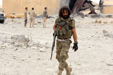Member of Libya's GNA holds his weapon after taking control of Watiya airbase. (Reuters)