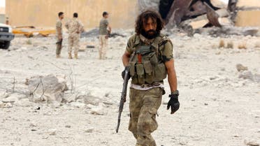 Member of Libya's GNA holds his weapon after taking control of Watiya airbase. (Reuters)