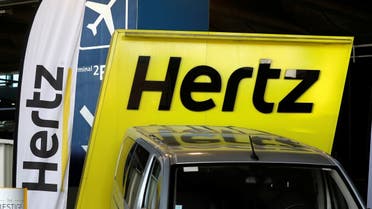 Logos of car rental company Hertz are seen outside Paris Charles de Gaulle airport in Roissy-en-France during the outbreak of the coronavirus disease. (Reuters)