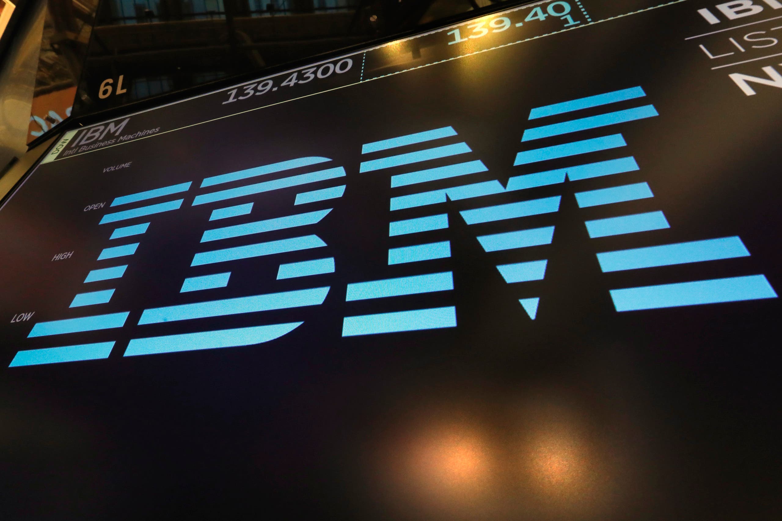 The logo for IBM appears above a trading post on the floor of the New York Stock Exchange. (AP)