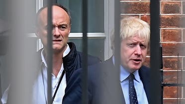 In this file photo taken on September 03, 2019 Britain's Prime Minister Boris Johnson (R) and his special advisor Dominic Cummings leave from the rear of Downing Street in central London. (AFP)