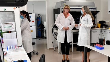 German Minister of Education and Research Anja Karliczek, center, talks with doctor Monique Breteler, during a visit at the German Center for Neurodegenerative Diseases (DZNE) in Bonn, Germany May 18, 2020. (Reuters)