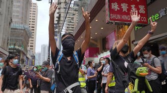 Hong Kong police fire volleys of tear gas as protesters take to streets