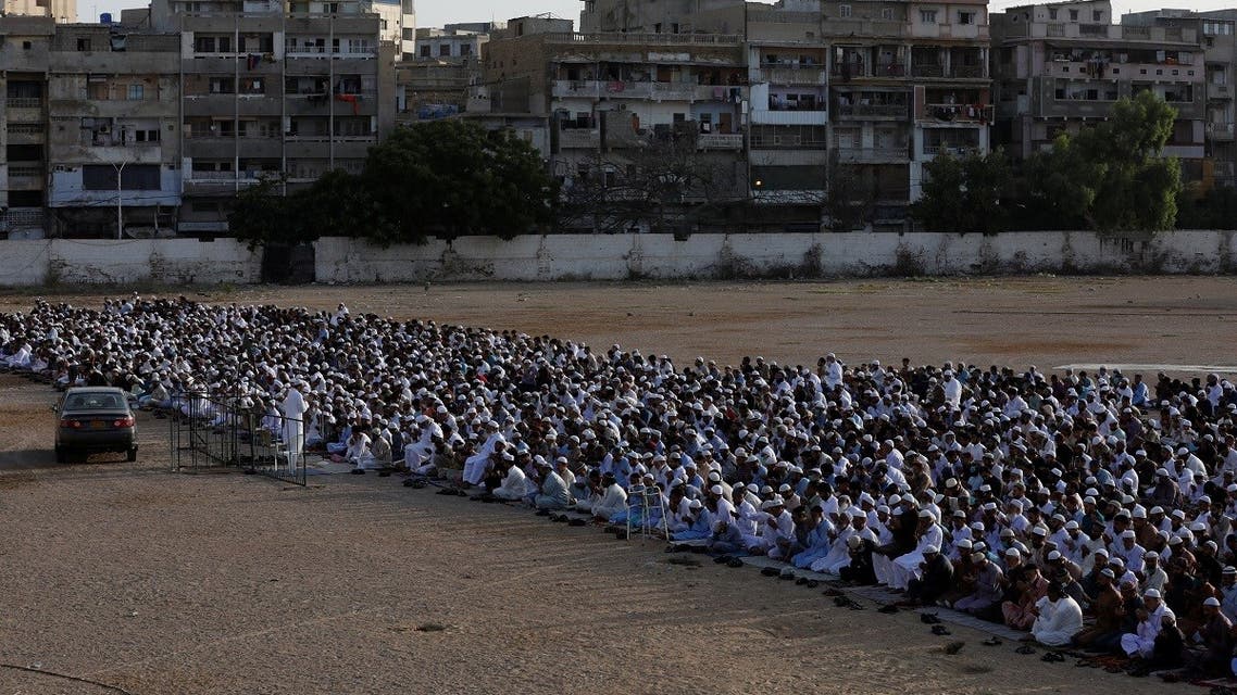 Pakistani Muslims celebrate Eid al-Fitr prayers to mark the end of the holy fasting month of Ramadan, amid the coronavirus disease (COVID-19) outbreak in Karachi, Pakistan May 24, 2020. (Reuters)