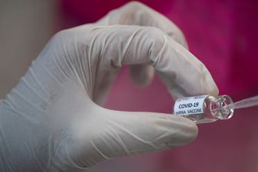 A researcher works inside a laboratory of Chulalongkorn University during the development of an mRNA type vaccine candidate for the coronavirus disease (COVID-19) in Bangkok, Thailand, May 25, 2020. (Reuters)