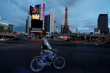 A man stands on his bicycle on the Las Vegas strip as the spread of COVID-19 continues, in Las Vegas, Nevada on April 10, 2020. (Reuters)