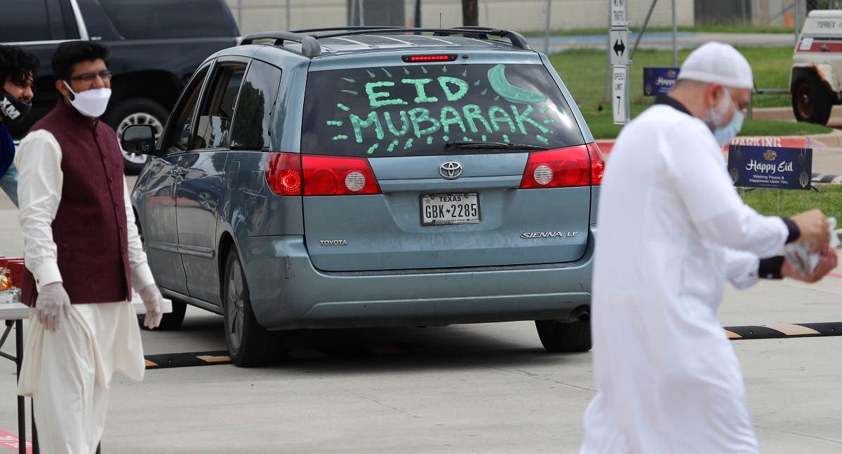 A message is written on the back of a vehicle during a drive-through Eid al-Fitr celebration outside a closed mosque in Plano, Texas, Sunday, May 24, 2020, during the coronavirus pandemic. (AP)