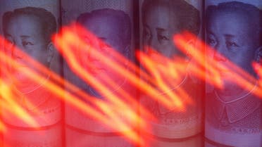 Chinese Yuan banknotes are seen behind illuminated stock graph in this illustration taken February 10, 2020. (Reuters)