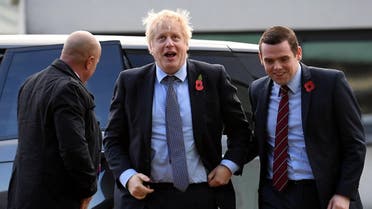Britain's Prime Minister Boris Johnson (C) is greeted by Conservative party candidate for Moray, Douglas Ross (R). (file photo afp)