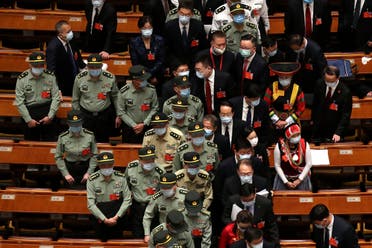 Military delegates leave after the opening session of China's National People's Congress (NPC) at the Great Hall of the People in Beijing on May 22, 2020. (AP)