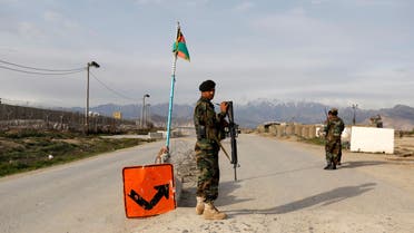 An Afghan National Army (ANA) soldier stands guard at a checkpoint outside Bagram prison, ahead of the release of 100 Taliban prisoners, north of Kabul, Afghanistan April 8, 2020. (Reuters)