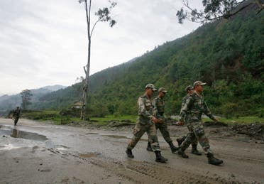 Indian army soldiers march near an army base on India's Tezpur-Tawang highway, which runs to the Chinese border, in the northeastern Indian state of Arunachal Pradesh on May 29, 2012. (Reuters)