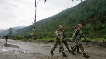 Indian army soldiers march near an army base on India's Tezpur-Tawang highway, which runs to the Chinese border, in the northeastern Indian state of Arunachal Pradesh May 29, 2012. Picture taken May 29, 2012. To match Special Report INDIA-CHINA/ REUTERS/Frank Jack Daniel (INDIA - Tags: POLITICS BUSINESS CONSTRUCTION MILITARY)