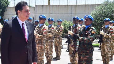 Lebanese Prime Minister Hassan Diab reviews the honor guard of the United Nations peacekeepers, upon his arrival at their headquarters in Naqoura, Lebanon on May 27, 2020. (AP)