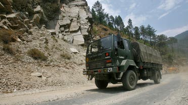 An Indian army truck drives along India's Tezpur-Tawang highway, which runs to the Chinese border, in the northeastern Indian state of Arunachal Pradesh May 28, 2012. Picture taken May 28, 2012. To match Special Report INDIA-CHINA/ REUTERS/Frank Jack Daniel (INDIA - Tags: POLITICS BUSINESS CONSTRUCTION MILITARY)