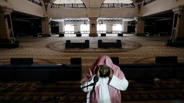 A cleric calls for the prayer at an empty Al-Rajhi Mosque, as Friday prayers were suspended following the spread of the coronavirus disease (COVID-19), in Riyadh. (Reuters)