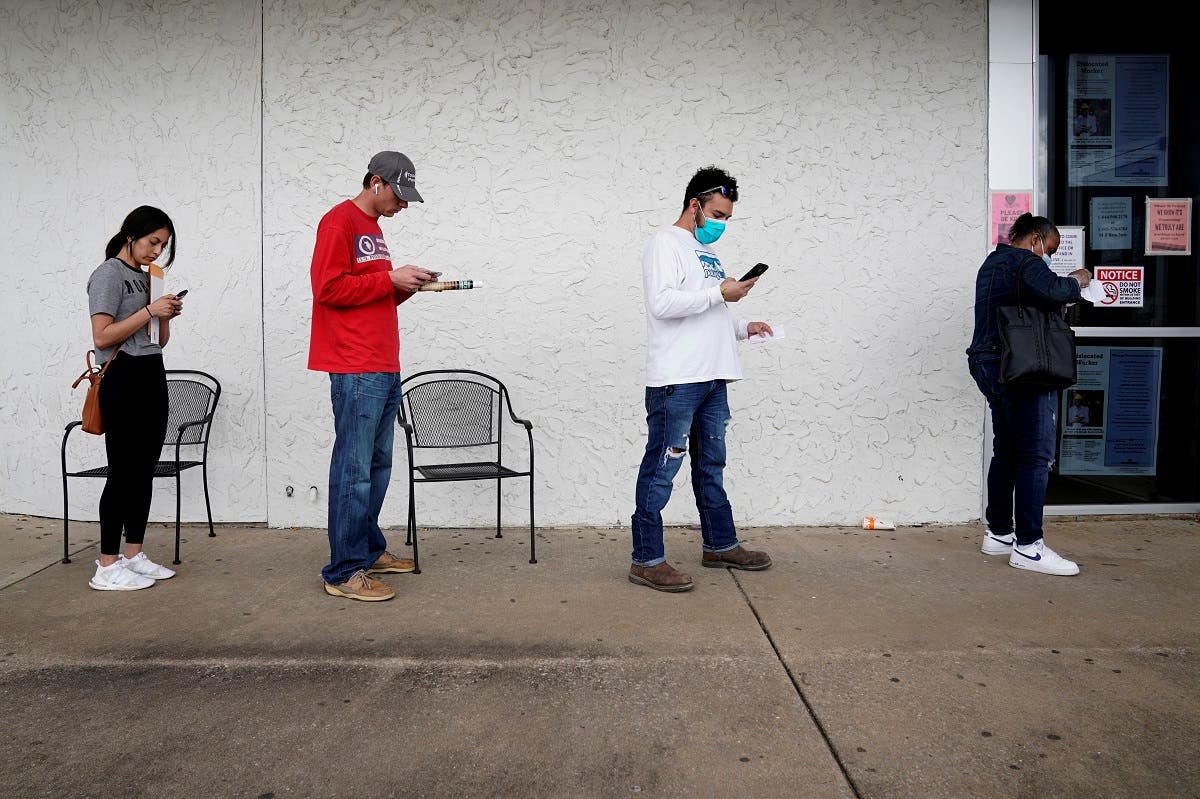 People who lost their jobs wait in line to file for unemployment following an outbreak of the coronavirus disease (COVID-19), at an Arkansas Workforce Center in Fayetteville, Arkansas, US. (File photo: Reuters)
