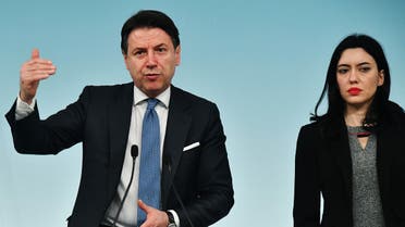 Italy's Prime Minister Giuseppe Conte (L) and Italy's Public Education Minister Lucia Azzolina speak during a press conference on March 4, 2020. (AFP)