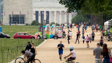 The Washington Monument and the Lincoln Memorial are visible as people visit the National Mall on Memorial Day in Washington on May 25, 2020. (AP)