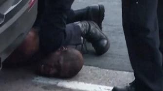 Unarmed black man dies as white policeman kneels on his neck