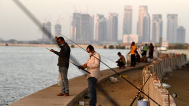 Men gather to fish at the creek in the Gulf city of Dubai, after the Emirati authorities eased some of the restrictions that were put in place in a bid to stem the spread of the novel coronavirus, on May 27, 2020. (AFP)
