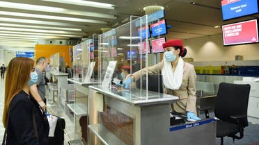 Emirates airlines implement coronavirus safety precautions at airport check-in counters in Dubai, UAE. (Twitter/@Emirates)