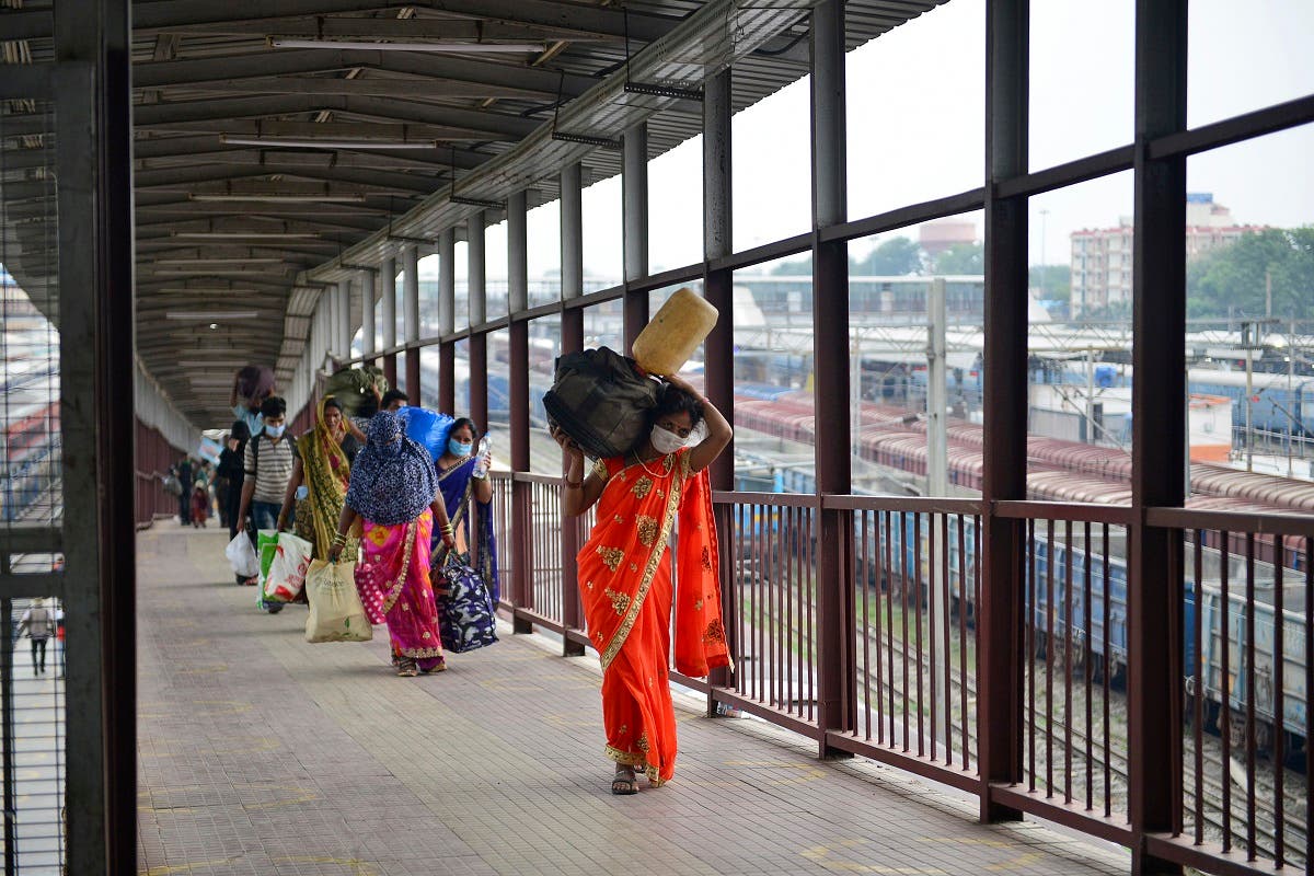 Passengers arrive from Mumbai after the government eased a nationwide lockdown to prevent the spread of the coronavirus, at the railway station in Allahabad on May 30, 2020. (AFP)